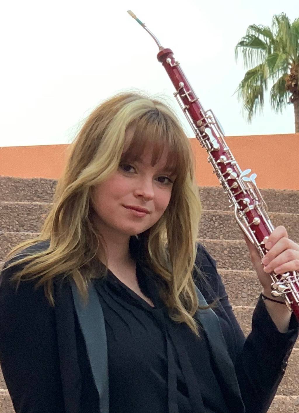 Lauren Glomb holding her English horn.